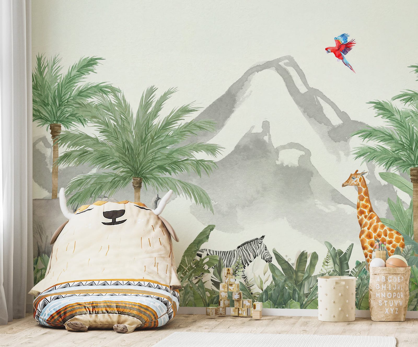 Children's room with a mountain and palm tree mural, stuffed animal.