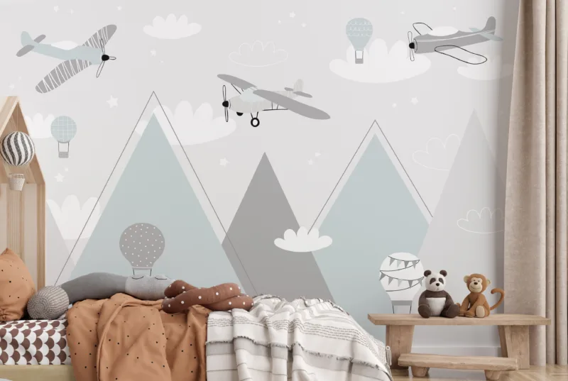Soft gray hot air balloons and pastel planes floating over mountains, ideal wall mural for baby nursery decor.